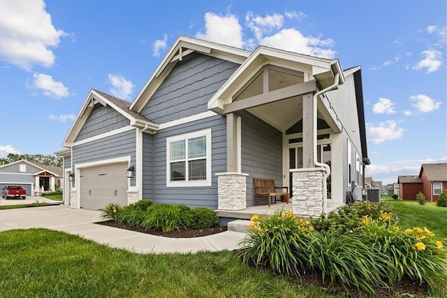 1517 SW Arbor Creek Dr, Lees Summit, MO 64082 - craftsman-style house featuring stone siding, concrete driveway, an attached garage, central air condition unit, and a front yard