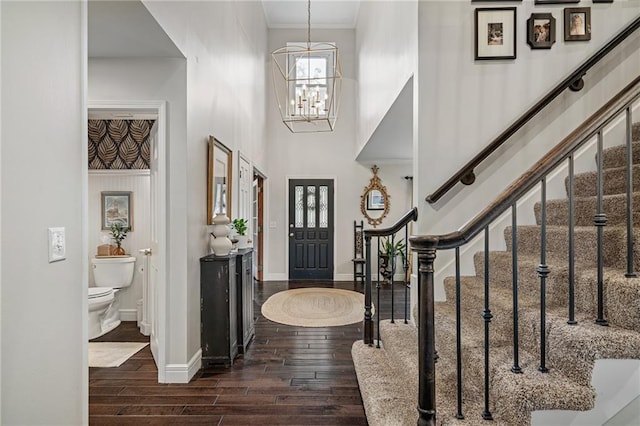 2204 W 123rd Ter, Leawood, KS 66209 - foyer with a towering ceiling, baseboards, wood finished floors, stairway, and a chandelier