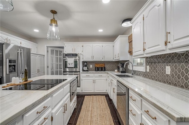 2204 W 123rd Ter, Leawood, KS 66209 - kitchen with a sink, stainless steel appliances, white cabinetry, backsplash, and recessed lighting