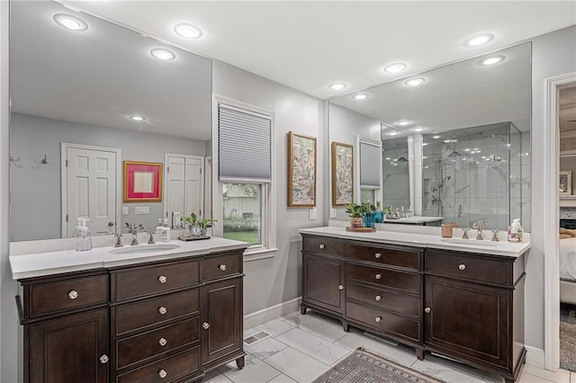 2204 W 123rd Ter, Leawood, KS 66209 - full bath featuring two vanities, a stall shower, baseboards, recessed lighting, and marble look tiles