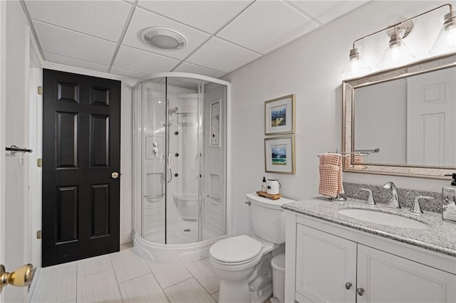 2204 W 123rd Ter, Leawood, KS 66209 - full bathroom with toilet, a shower stall, vanity, tile patterned floors, and a paneled ceiling