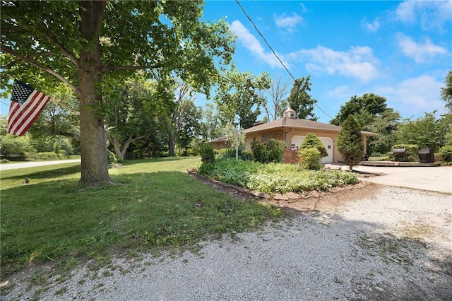 3814 S Outer Belt Rd, Oak Grove, MO 64075 - view of home's exterior featuring an attached garage, a lawn, and concrete driveway