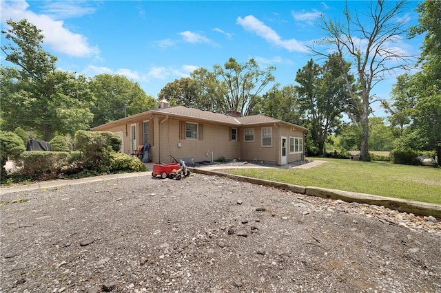 3814 S Outer Belt Rd, Oak Grove, MO 64075 - view of front of house featuring a chimney and a front yard