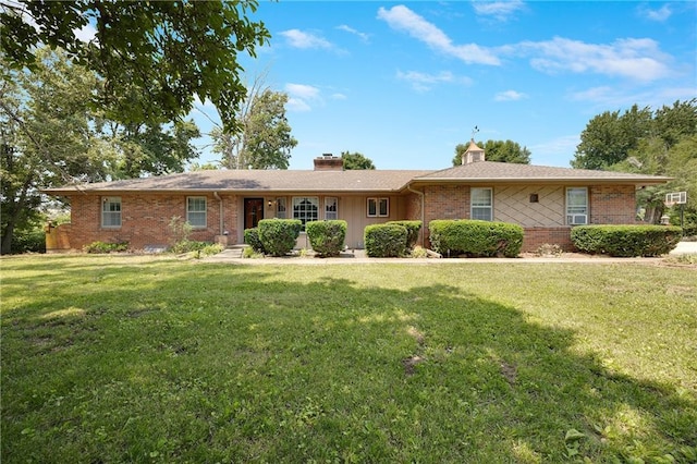 3814 S Outer Belt Rd, Oak Grove, MO 64075 - ranch-style house with a chimney, brick siding, and a front yard