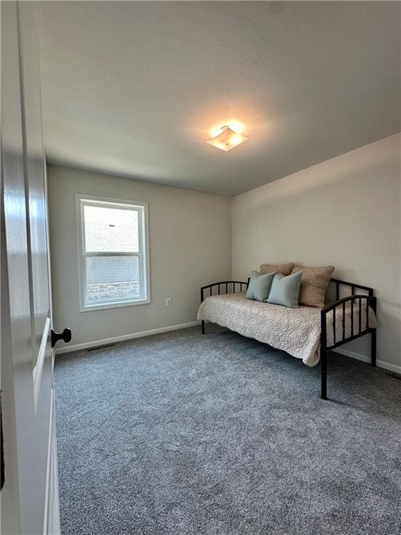 904 N 9th St, Neodesha, KS 66757 - carpeted bedroom featuring baseboards