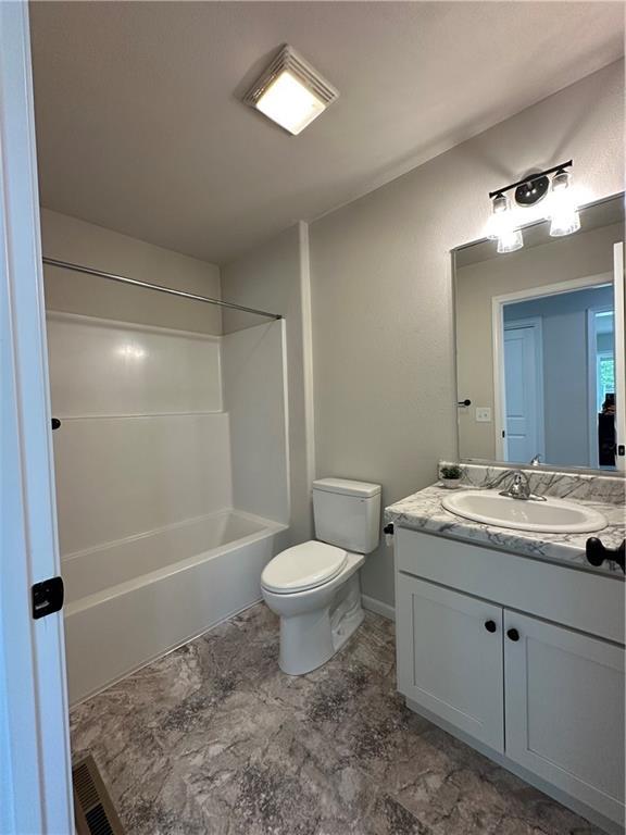 904 N 9th St, Neodesha, KS 66757 - bathroom featuring vanity and shower / bathtub combination