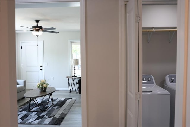 904 N 9th St, Neodesha, KS 66757 - washroom featuring washer and dryer, ceiling fan, and wood finished floors