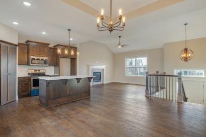 18408 Rock Creek Dr N, Smithville, MO 64089 - kitchen featuring stainless steel appliances, a chandelier, dark wood finished floors, vaulted ceiling, and a ceiling fan