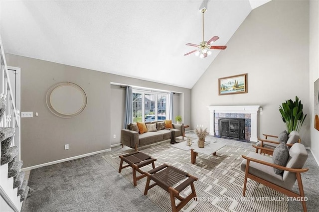 701 NE Hunters Cir, Blue Springs, MO 64014 - carpeted living area featuring a tiled fireplace, high vaulted ceiling, and a ceiling fan