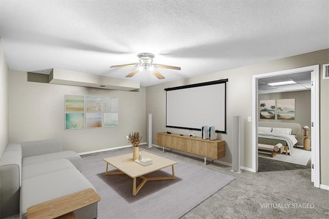 701 NE Hunters Cir, Blue Springs, MO 64014 - carpeted cinema room with a ceiling fan and a textured ceiling