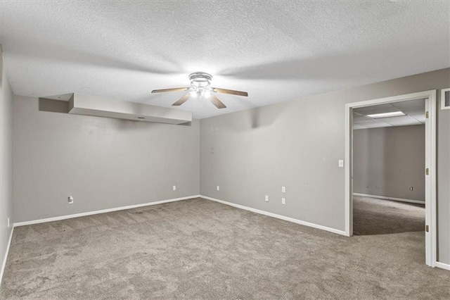 701 NE Hunters Cir, Blue Springs, MO 64014 - carpeted spare room with ceiling fan and a textured ceiling