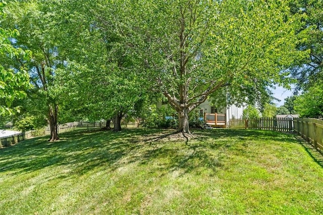 701 NE Hunters Cir, Blue Springs, MO 64014 - fenced backyard featuring a deck
