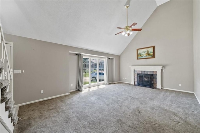 701 NE Hunters Cir, Blue Springs, MO 64014 - unfurnished living room featuring a fireplace, a ceiling fan, carpet, and high vaulted ceiling
