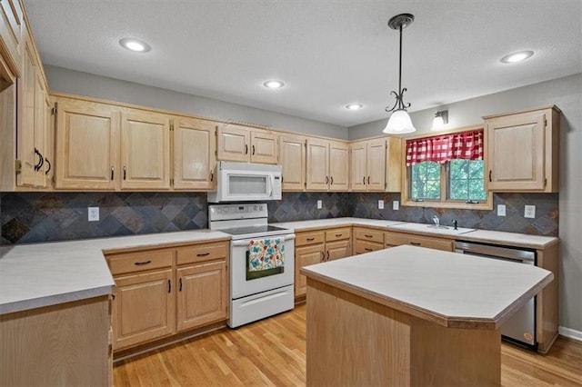 701 NE Hunters Cir, Blue Springs, MO 64014 - kitchen featuring white appliances, light brown cabinetry, light countertops, light wood-style floors, and recessed lighting