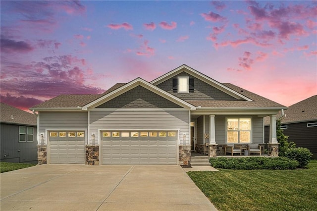 24842 W 144th St, Olathe, KS 66061 - view of front facade featuring a porch, driveway, stone siding, and an attached garage