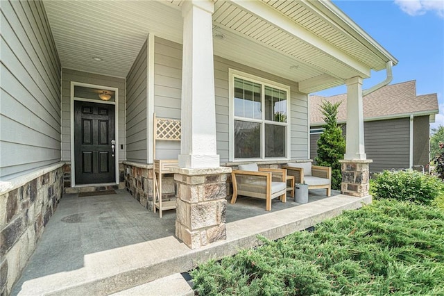 24842 W 144th St, Olathe, KS 66061 - property entrance featuring covered porch and stone siding