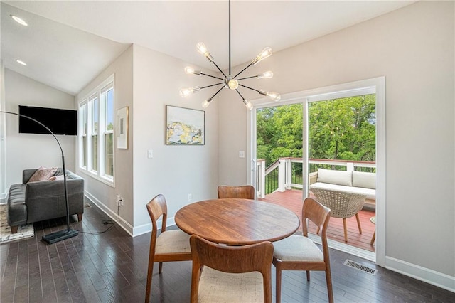24842 W 144th St, Olathe, KS 66061 - dining room featuring vaulted ceiling, a chandelier, dark wood-style floors, and baseboards