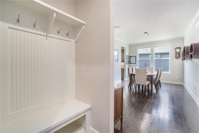 24842 W 144th St, Olathe, KS 66061 - mudroom with ornamental molding, dark wood finished floors, baseboards, and a textured ceiling