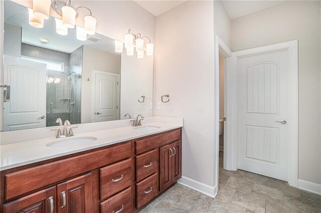 24842 W 144th St, Olathe, KS 66061 - bathroom with double vanity, baseboards, and a shower stall