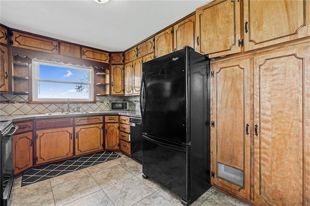 31882 W 180th St, Lawson, MO 64062 - kitchen featuring black appliances, a sink, open shelves, decorative backsplash, and brown cabinetry