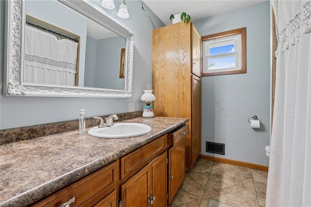 31882 W 180th St, Lawson, MO 64062 - bathroom featuring vanity, toilet, and baseboards