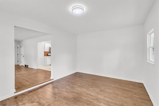 12926 Virginia Ave, Kansas City, MO 64146 - unfurnished room with wood finished floors and baseboards