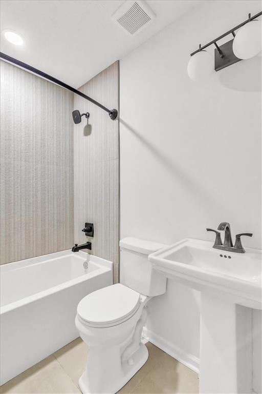 12926 Virginia Ave, Kansas City, MO 64146 - full bath with toilet, bathtub / shower combination, tile patterned flooring, and a sink