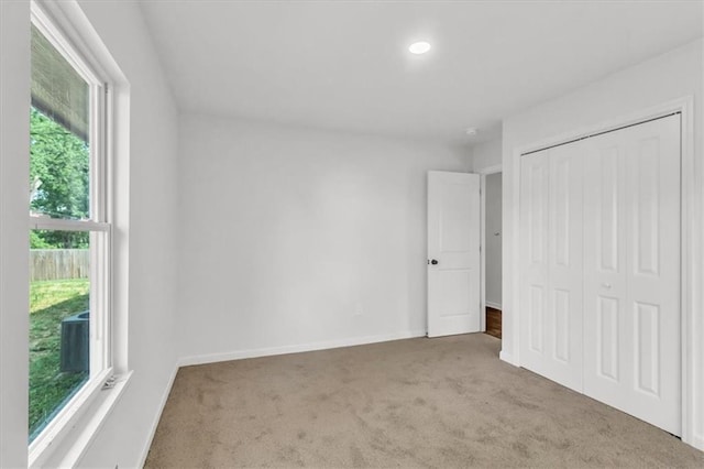 12926 Virginia Ave, Kansas City, MO 64146 - unfurnished bedroom with carpet floors, a closet, recessed lighting, and baseboards