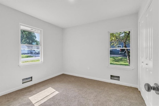 12926 Virginia Ave, Kansas City, MO 64146 - empty room featuring carpet and healthy amount of natural light