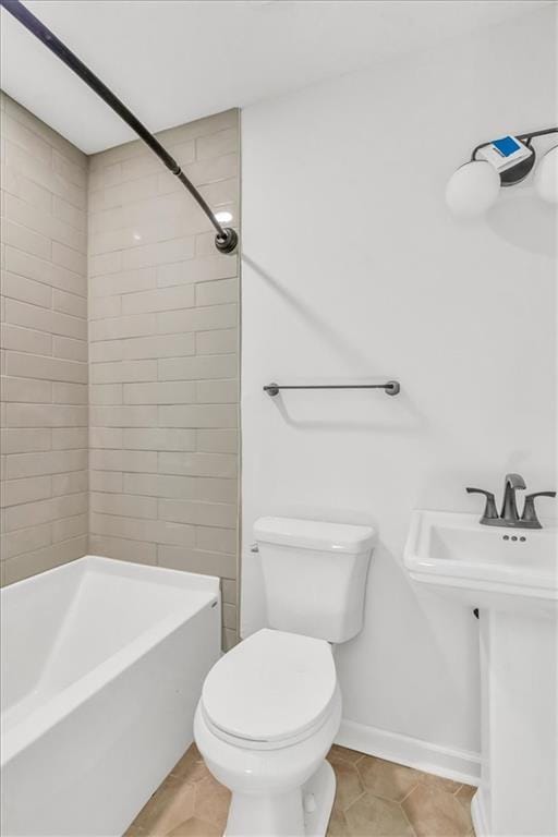 12926 Virginia Ave, Kansas City, MO 64146 - full bath with toilet, shower / bathtub combination, baseboards, and tile patterned flooring