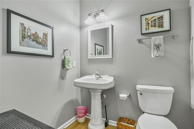 6522 W 133rd Ter, Leawood, KS 66209 - half bathroom with toilet and wood finished floors