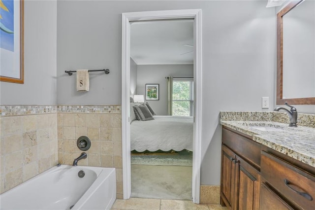 6522 W 133rd Ter, Leawood, KS 66209 - ensuite bathroom with vanity, a bath, and tile patterned floors