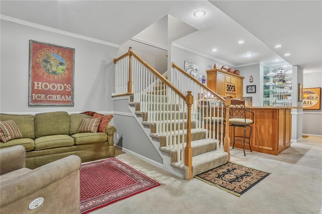6522 W 133rd Ter, Leawood, KS 66209 - living room with ornamental molding, light carpet, stairs, recessed lighting, and bar area