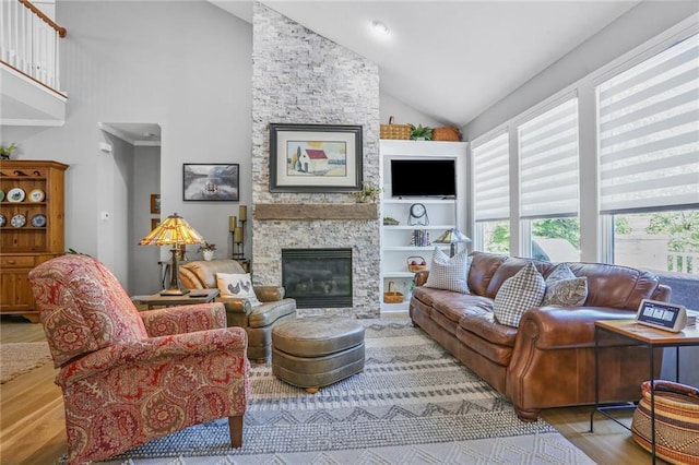 6522 W 133rd Ter, Leawood, KS 66209 - living room with wood finished floors, a stone fireplace, and high vaulted ceiling