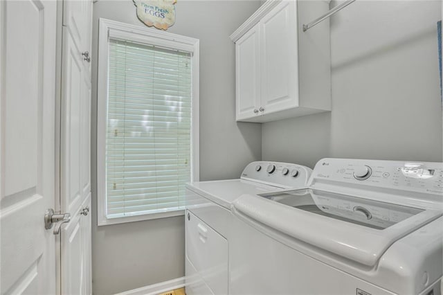 6522 W 133rd Ter, Leawood, KS 66209 - washroom with washing machine and clothes dryer and cabinet space