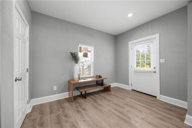 3332 Flora Ave, Kansas City, MO 64109 - entryway featuring light wood-style flooring, baseboards, and recessed lighting