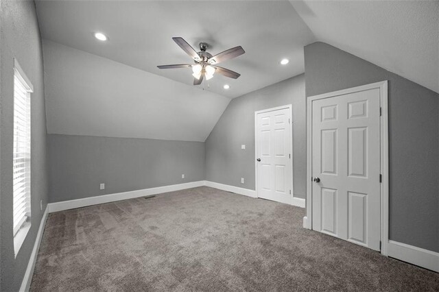 3332 Flora Ave, Kansas City, MO 64109 - additional living space with lofted ceiling, ceiling fan, carpet floors, baseboards, and recessed lighting