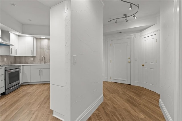 9100 Lamar Ave Unit 107, Overland Park, KS 66207 - corridor featuring light wood finished floors and track lighting