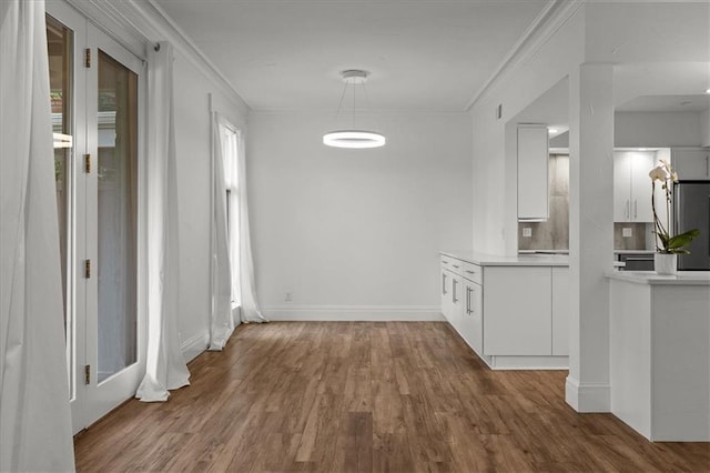 9100 Lamar Ave Unit 107, Overland Park, KS 66207 - hall with wood finished floors, ornamental molding, and healthy amount of natural light