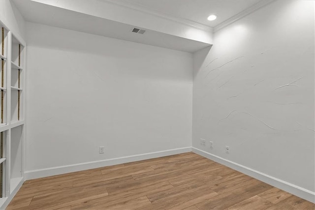 9100 Lamar Ave Unit 107, Overland Park, KS 66207 - unfurnished room with light wood-style flooring, crown molding, and recessed lighting
