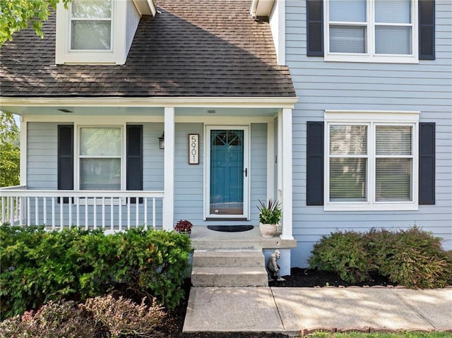 5901 W 158th St, Overland Park, KS 66223 - property entrance with roof with shingles and a porch