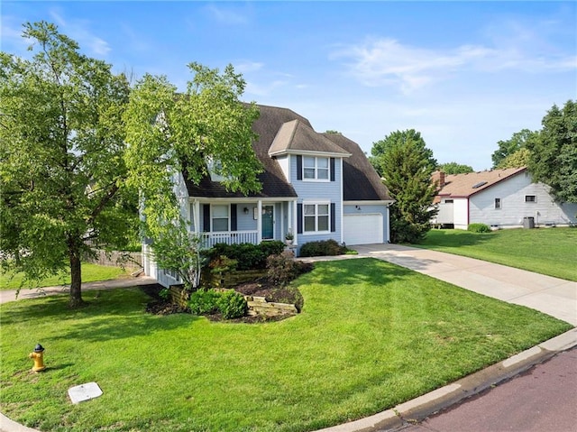 5901 W 158th St, Overland Park, KS 66223 - view of front of property featuring concrete driveway, covered porch, a front lawn, and a garage