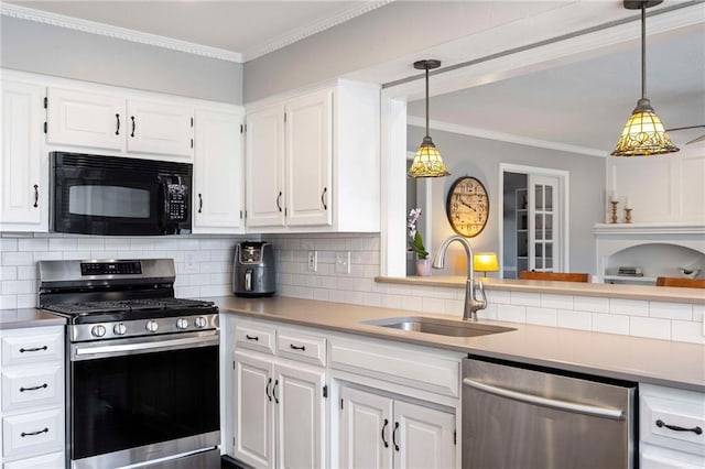 5901 W 158th St, Overland Park, KS 66223 - kitchen with appliances with stainless steel finishes, a sink, white cabinets, backsplash, and hanging light fixtures