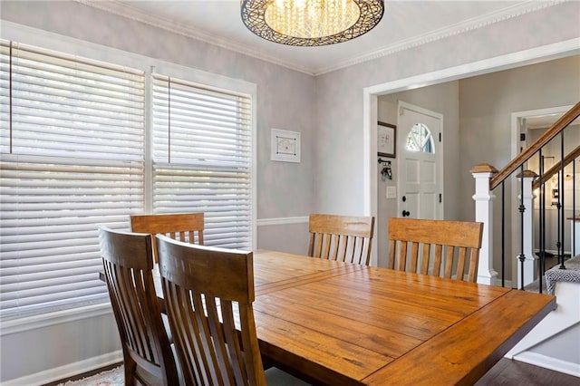5901 W 158th St, Overland Park, KS 66223 - dining area with a chandelier, crown molding, stairs, baseboards, and wood finished floors