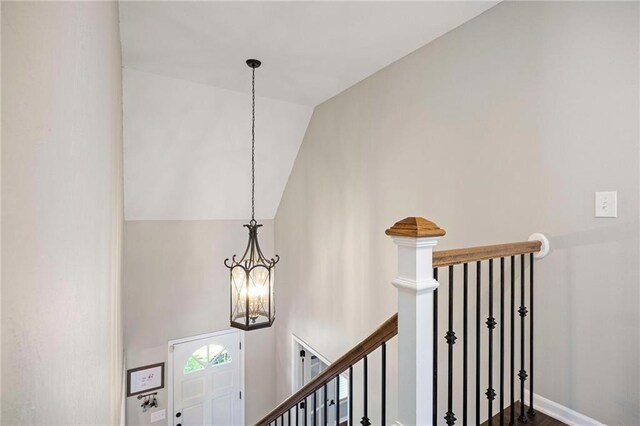 5901 W 158th St, Overland Park, KS 66223 - stairway featuring a chandelier and vaulted ceiling