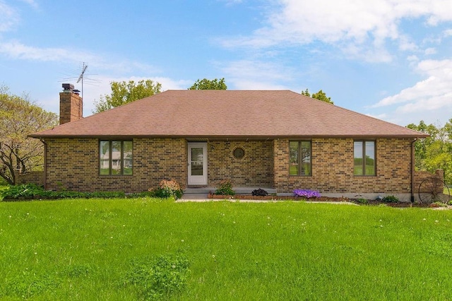 34701 E 235th St, Pleasant Hill, MO 64080 - view of front facade with a chimney, a front lawn, brick siding, and roof with shingles