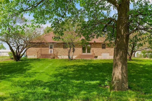 34701 E 235th St, Pleasant Hill, MO 64080 - rear view of house featuring a yard and brick siding