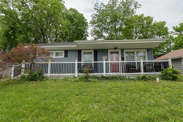 822 S Noland Rd, Independence, MO 64050 - ranch-style home featuring covered porch, a front lawn, and board and batten siding