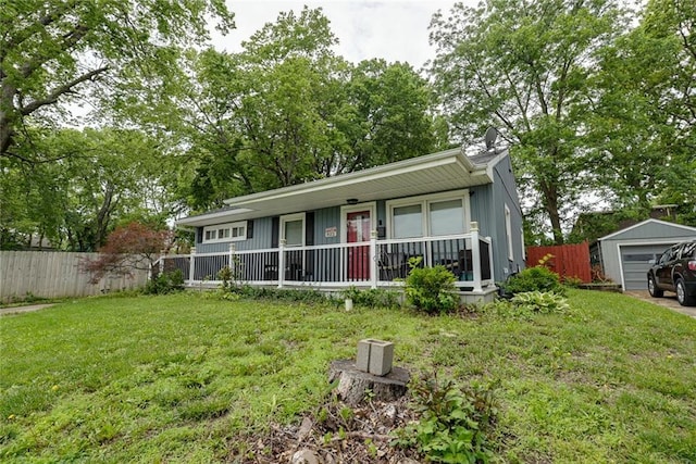 822 S Noland Rd, Independence, MO 64050 - view of front of house featuring a porch and a detached garage