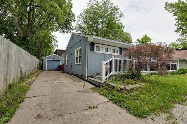 822 S Noland Rd, Independence, MO 64050 - view of front of property with driveway, a garage, and an outbuilding